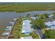 Waterfront condominiums with private boat docks surrounded by lush landscaping offer picturesque living and waterway access at 76 Heather Point Ct, New Smyrna Beach, FL 32169