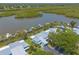 Waterfront condos with boat docks offer stunning views and convenient access to waterways in a lush tropical environment at 76 Heather Point Ct, New Smyrna Beach, FL 32169
