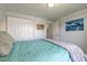 Cozy bedroom featuring soothing blue walls, a comfortable bed, and tasteful coastal-themed decor at 76 Heather Point Ct, New Smyrna Beach, FL 32169