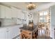 Open-concept kitchen, living and dining area with bright light and island counter at 76 Heather Point Ct, New Smyrna Beach, FL 32169