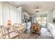 Bright kitchen with white cabinets, stainless steel appliances, and a view to the outside deck at 76 Heather Point Ct, New Smyrna Beach, FL 32169