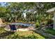 Pool area in a backyard surrounded by landscaping at 804 E 12Th Ave, New Smyrna Beach, FL 32169