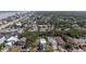 An aerial view displays neighborhood homes with mature landscaping near a Florida coastline at 833 E 12Th Ave, New Smyrna Beach, FL 32169