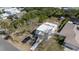 Aerial shot of the house showcasing its location among lush greenery and neighboring properties, creating a neighborhood feel at 833 E 12Th Ave, New Smyrna Beach, FL 32169