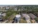 Aerial view of the property surrounded by lush greenery and neighborhood homes near the ocean, perfect location at 833 E 12Th Ave, New Smyrna Beach, FL 32169