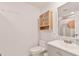 Modern bathroom with sleek vanity, toilet, wooden cabinet, and shower at 833 E 12Th Ave, New Smyrna Beach, FL 32169