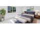 Cozy bedroom features a comfortable bed, stylish decor, and plenty of natural light at 833 E 12Th Ave, New Smyrna Beach, FL 32169