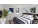 Inviting bedroom features a comfortable bed, stylish decor, and plenty of natural light at 833 E 12Th Ave, New Smyrna Beach, FL 32169