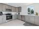 Modern kitchen boasts sleek countertops, stainless steel appliances, and ample cabinet space for all your culinary needs at 833 E 12Th Ave, New Smyrna Beach, FL 32169