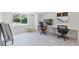 Bright office space with two desks, neutral tones, and a large window, great for a productive workspace at 833 E 12Th Ave, New Smyrna Beach, FL 32169