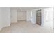 Spacious room with white walls and a stainless steel refrigerator at 833 E 12Th Ave, New Smyrna Beach, FL 32169