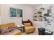 Cozy room features comfortable seating, natural light and charming decor at 833 E 12Th Ave, New Smyrna Beach, FL 32169