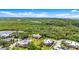 Aerial view showcasing neighborhood adjacent to wetlands at 94 Cedar Dunes Dr, New Smyrna Beach, FL 32169