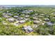 Aerial view of a peaceful community with well-maintained landscaping at 94 Cedar Dunes Dr, New Smyrna Beach, FL 32169