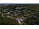 Stunning aerial view of a serene community with lush greenery near the coast at 94 Cedar Dunes Dr, New Smyrna Beach, FL 32169
