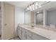 This bathroom features a large mirror, marble countertop, and modern vanity at 94 Cedar Dunes Dr, New Smyrna Beach, FL 32169