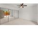 Large bedroom with mirrored closet doors at 94 Cedar Dunes Dr, New Smyrna Beach, FL 32169