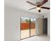 Bedroom with sliding glass doors leading to patio at 94 Cedar Dunes Dr, New Smyrna Beach, FL 32169