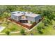 Charming home featuring a fenced yard and a private balcony overlooking lush greenery at 94 Cedar Dunes Dr, New Smyrna Beach, FL 32169