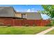 A well-maintained property with a fenced yard and manicured lawn at 94 Cedar Dunes Dr, New Smyrna Beach, FL 32169