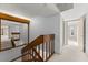 Hallway on the second story with staircase and open entrance at 94 Cedar Dunes Dr, New Smyrna Beach, FL 32169