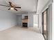 Living room with a fireplace and glass sliding door at 94 Cedar Dunes Dr, New Smyrna Beach, FL 32169