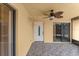 Covered back patio features brick pavers and ceiling fan at 94 Cedar Dunes Dr, New Smyrna Beach, FL 32169