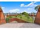 Spacious outdoor patio area with community view, fenced perimeter, and tiled flooring at 94 Cedar Dunes Dr, New Smyrna Beach, FL 32169