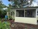 Cozy screened in porch and garden in backyard at 125 Rio Vista Dr, Edgewater, FL 32132