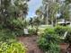 Backyard with chairs and mature landscaping at 125 Rio Vista Dr, Edgewater, FL 32132