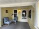 Inviting front porch with chairs and decor provides a charming spot for relaxation at 125 Rio Vista Dr, Edgewater, FL 32132