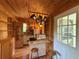Charming kitchen features hanging pot rack, shelving, and eat-in island at 125 Rio Vista Dr, Edgewater, FL 32132