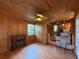 Comfortable living area featuring a fireplace and an adjacent kitchen at 125 Rio Vista Dr, Edgewater, FL 32132