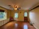 Inviting living room with hardwood floors, built-in shelving, and ample natural light at 125 Rio Vista Dr, Edgewater, FL 32132