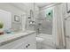 Charming bathroom featuring an elegant vanity with granite counters and a shower-tub combo at 1290 9Th St, Orange City, FL 32763