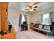 Versatile bedroom with windows, a ceiling fan, and a comfortable futon at 130 N Gaines St, Oak Hill, FL 32759