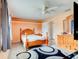 Comfortable bedroom with ceiling fan, neutral walls, and ample natural light at 130 N Gaines St, Oak Hill, FL 32759