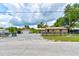Spacious property with home, garages, and driveways offering ample space at 130 N Gaines St, Oak Hill, FL 32759