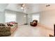 Cozy living room with tile flooring, comfortable seating, and natural light at 130 N Gaines St, Oak Hill, FL 32759