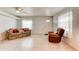 Cozy living room with tile flooring, comfortable seating, and natural light at 130 N Gaines St, Oak Hill, FL 32759