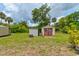 View of the metal and wood shed in the backyard of the property at 130 N Gaines St, Oak Hill, FL 32759