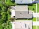 Aerial view showcases the layout of the property, including the rooftop, yard, and outdoor patio areas at 1327 Wayne Ave, New Smyrna Beach, FL 32168