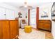 Cozy bedroom featuring hardwood floors, neutral walls, and bright natural light at 1327 Wayne Ave, New Smyrna Beach, FL 32168