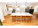 Bright kitchen with white cabinets, a large island, and stainless steel appliances at 1327 Wayne Ave, New Smyrna Beach, FL 32168
