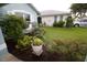 Landscaping along exterior of home, showing colorful potted plants and bushes at 1327 Wayne Ave, New Smyrna Beach, FL 32168