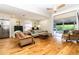 Bright living room with hardwood floors and sliding glass doors for indoor-outdoor living at 1327 Wayne Ave, New Smyrna Beach, FL 32168