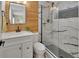Modern bathroom with beautiful tiling, sleek vanity, and walk-in shower with rainfall showerhead at 1382 Coronet Dr, Deltona, FL 32725