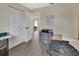 Cozy bedroom features wood flooring and an open doorway to another bedroom at 1382 Coronet Dr, Deltona, FL 32725