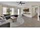 A sun-filled living room with modern decor and easy access to the outdoors at 1382 Coronet Dr, Deltona, FL 32725