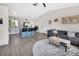 Open-concept living space with a view of the island and modern design features at 1382 Coronet Dr, Deltona, FL 32725
